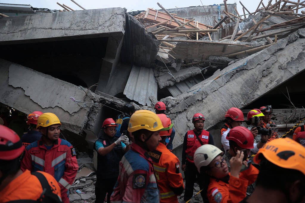 At least 91 students remain buried in rubble after Indonesia school collapse